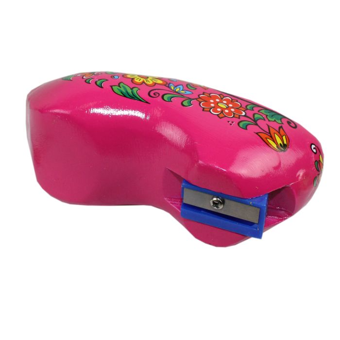 Pink clog with pencils and sharpener
