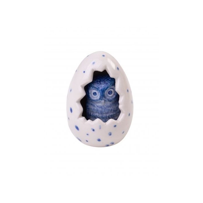 Miniature owl in dotted egg