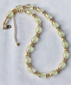 Ketting licht creme kleurige facetgeslepen 15x10mm kralen