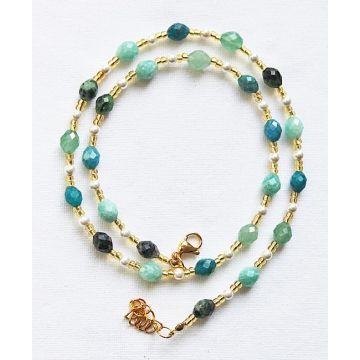 Ketting met verschillende facetgeslepen edelsteen kralen van 9x6mm.
