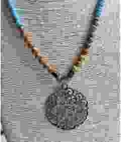 Necklace Boho style with bronze filigrain pendant