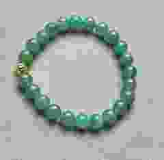 Bracelet 8mm green Aventurine beads with gold colored bead