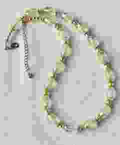 Ketting licht creme kleurige facetgeslepen 15x10mm kralen 