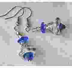 earring silver colored flower with sapphire blue bead