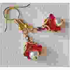 Red flower earrings with gold colored filigree bead cap