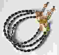 Armband zwarte kralen met goudkleurige rand