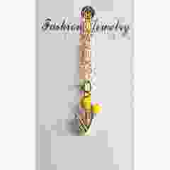 Gele tulphanger aan goudkleurige ketting