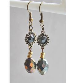 Facetgeslepen barok oorbellen met gitzwart tussenstukje