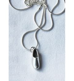 Necklace with silver colored metal clog 